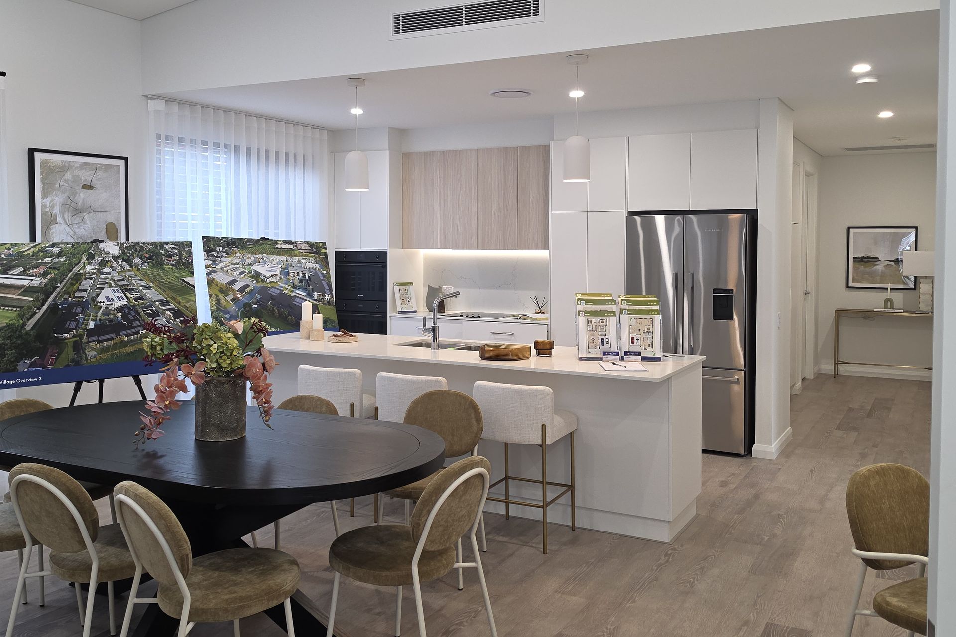 Open-plan kitchen with a ducted air conditioning outlet, installed by Baramenco