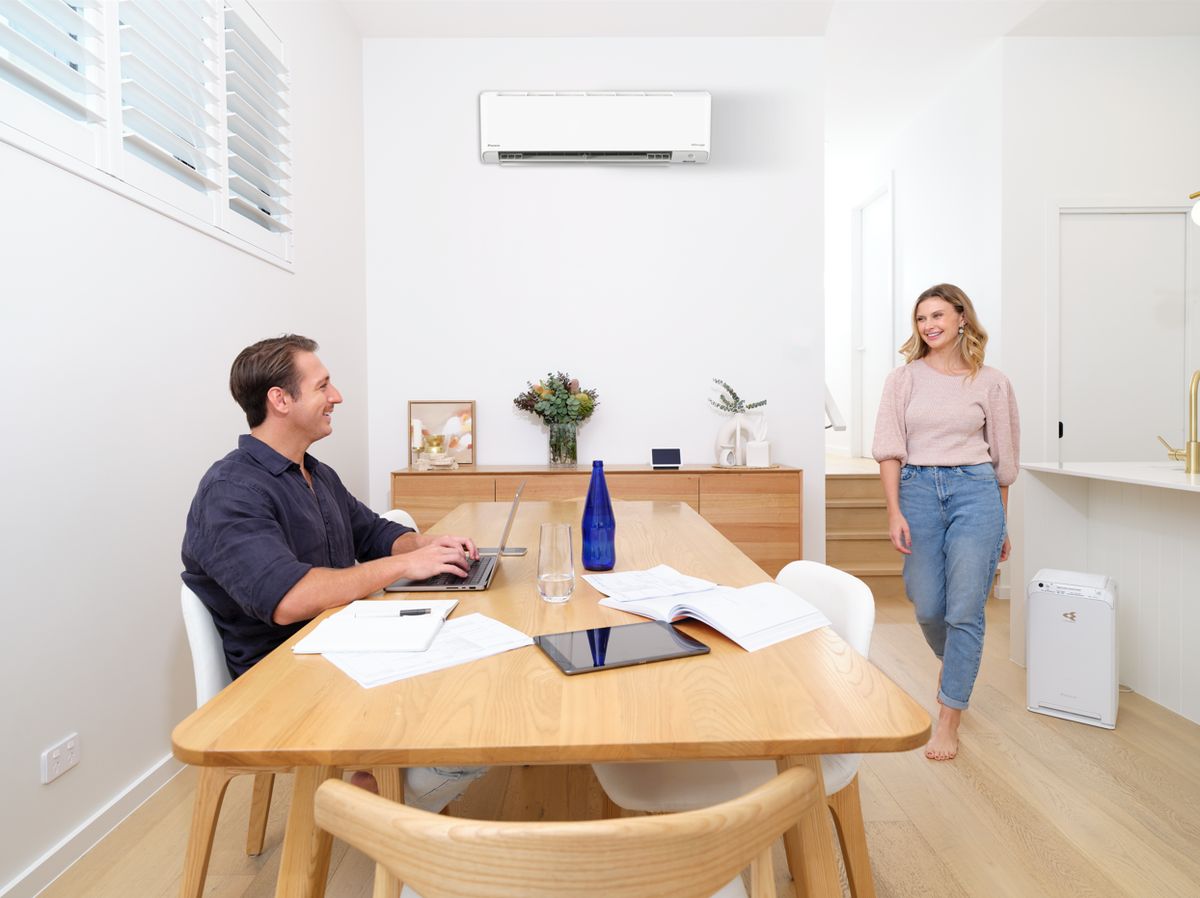 Daikin split system wall unit above a dining area